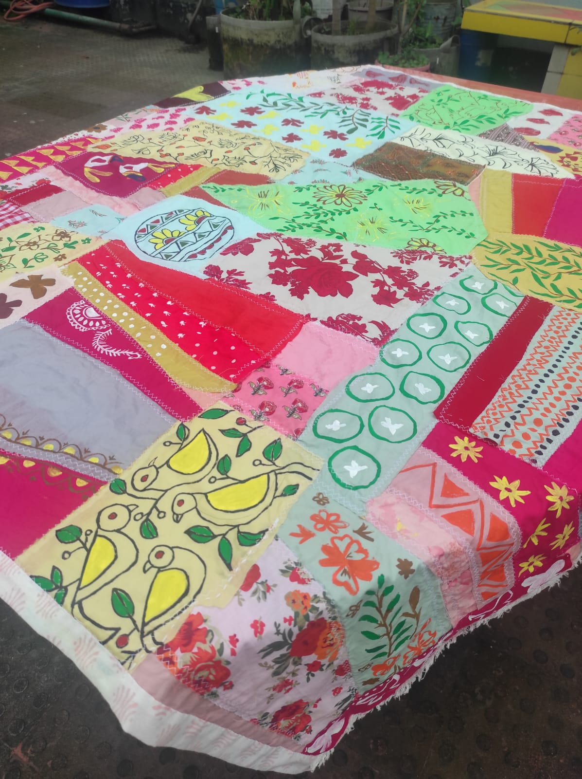 Colorful display of handmade textile crafts and fabric decorations
