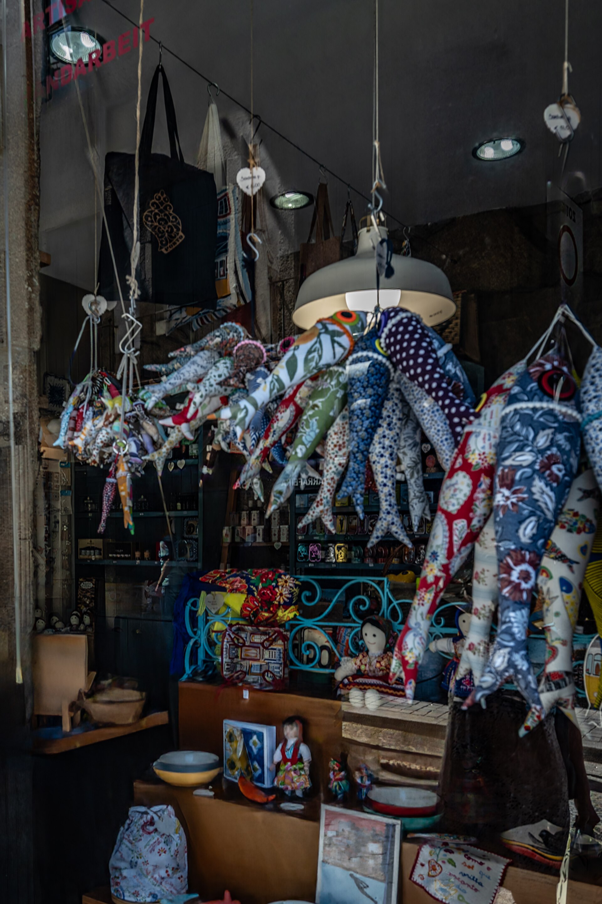Colorful display of handmade textile crafts and fabric decorations
