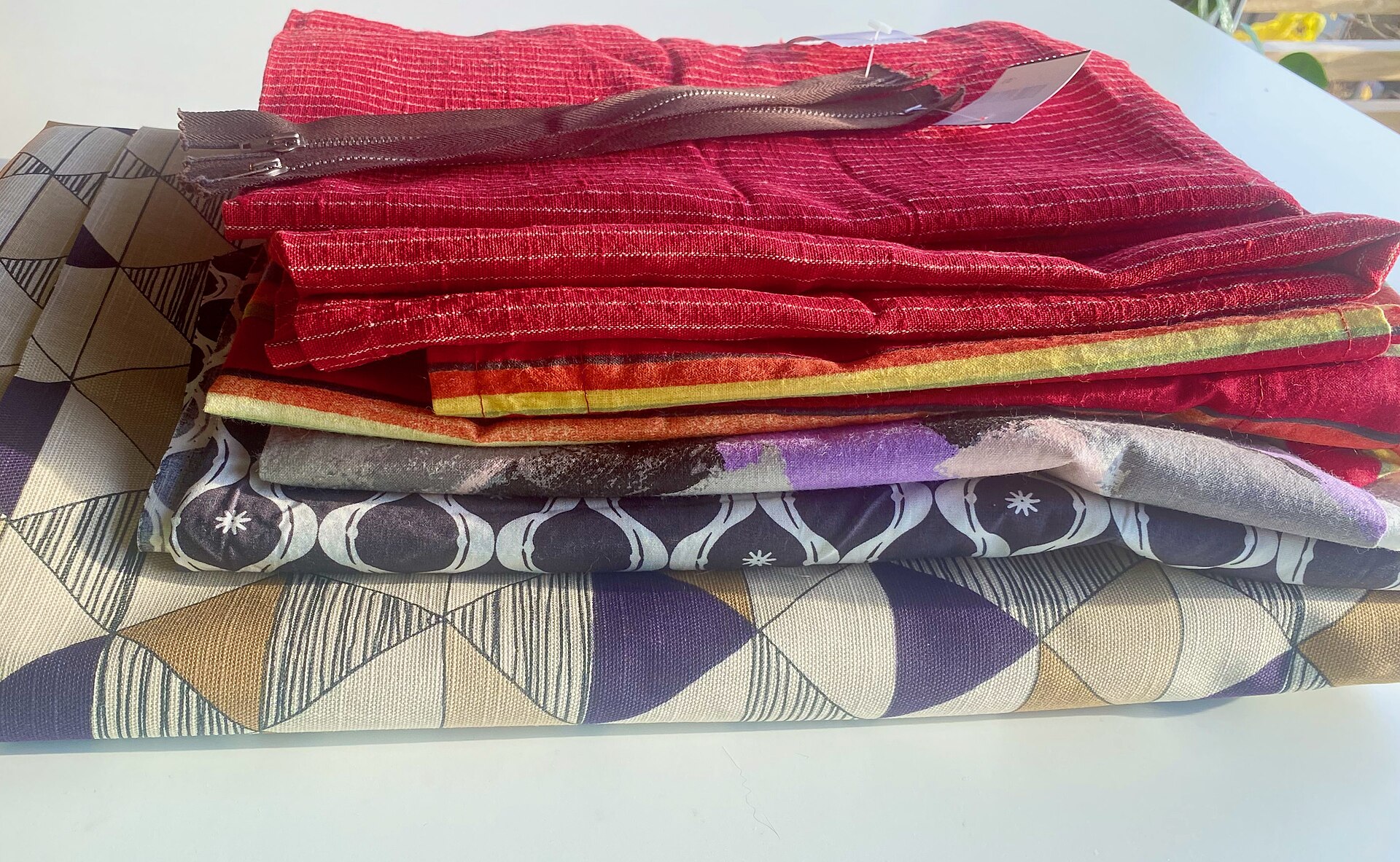 Assorted colorful fabric scraps ready for creative reuse