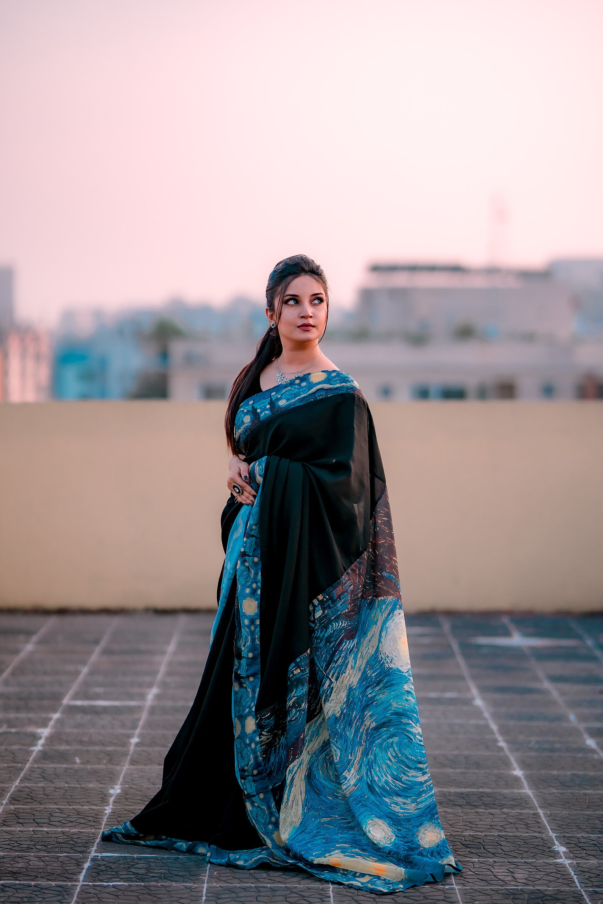 Hand-painted blue cotton saree displayed on a mannequin